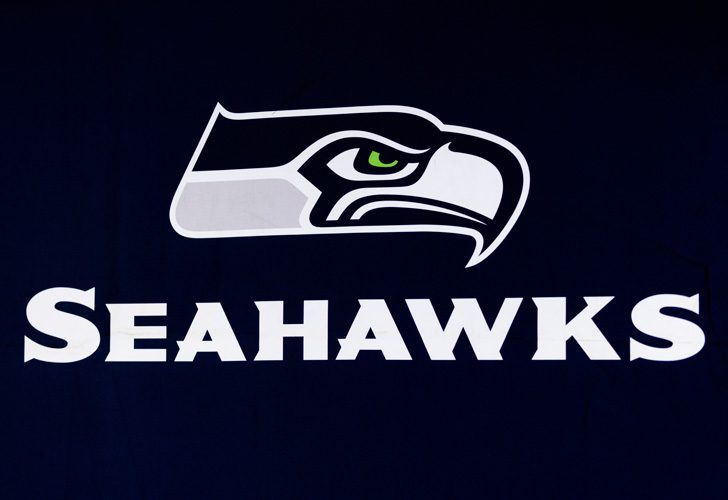 Seattle Seahawks team logo with a stylized hawk head on a dark blue background.