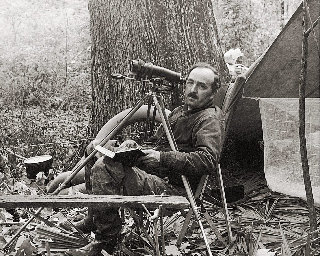 In 1935, Arthur Allen (above) launched a cross-country expedition to record the vanishing birds of America, making still photographs, motion pictures, and sound recordings of numerous species. Above, he observes an Ivory-billed Woodpecker nest in Louisiana. Photo: Cornell Lab Archives