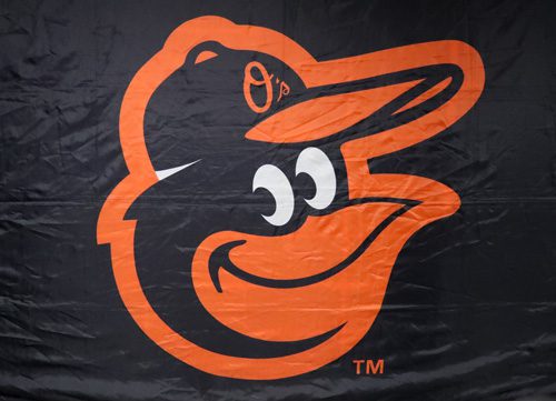 Baltimore Orioles team logo featuring an orange cartoon bird head wearing a baseball cap on a black background.